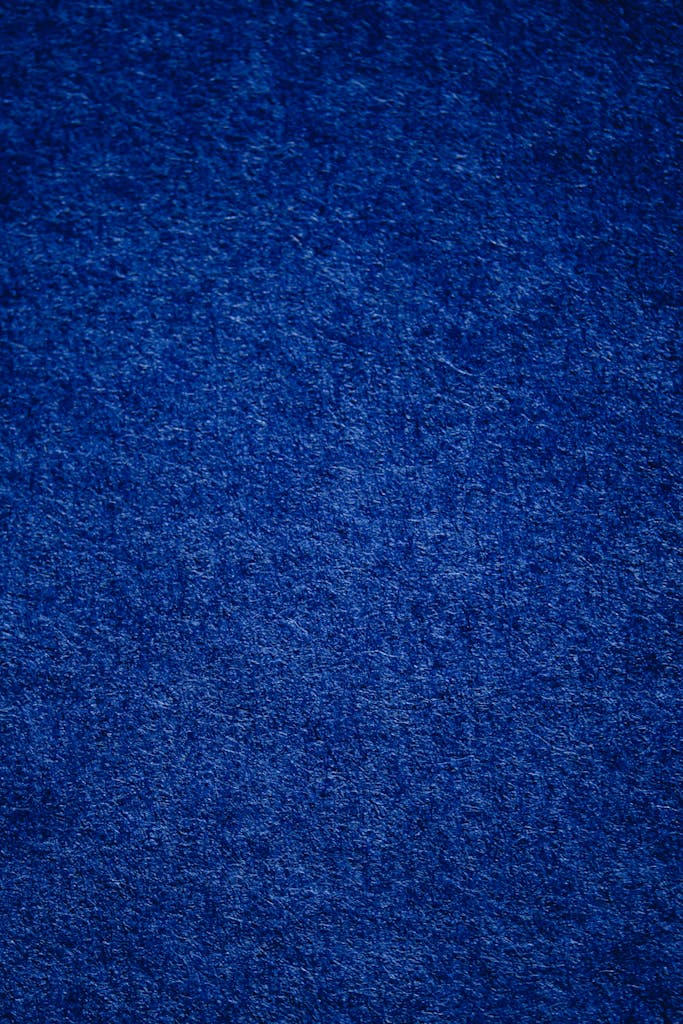 Close-up shot of a blue textured surface, ideal for design backdrops.